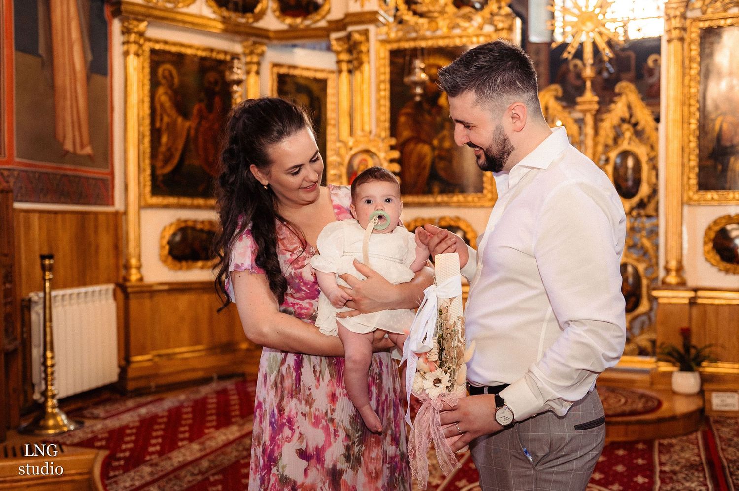 A family sharing a happy moment together in an ornately decorated church interior.