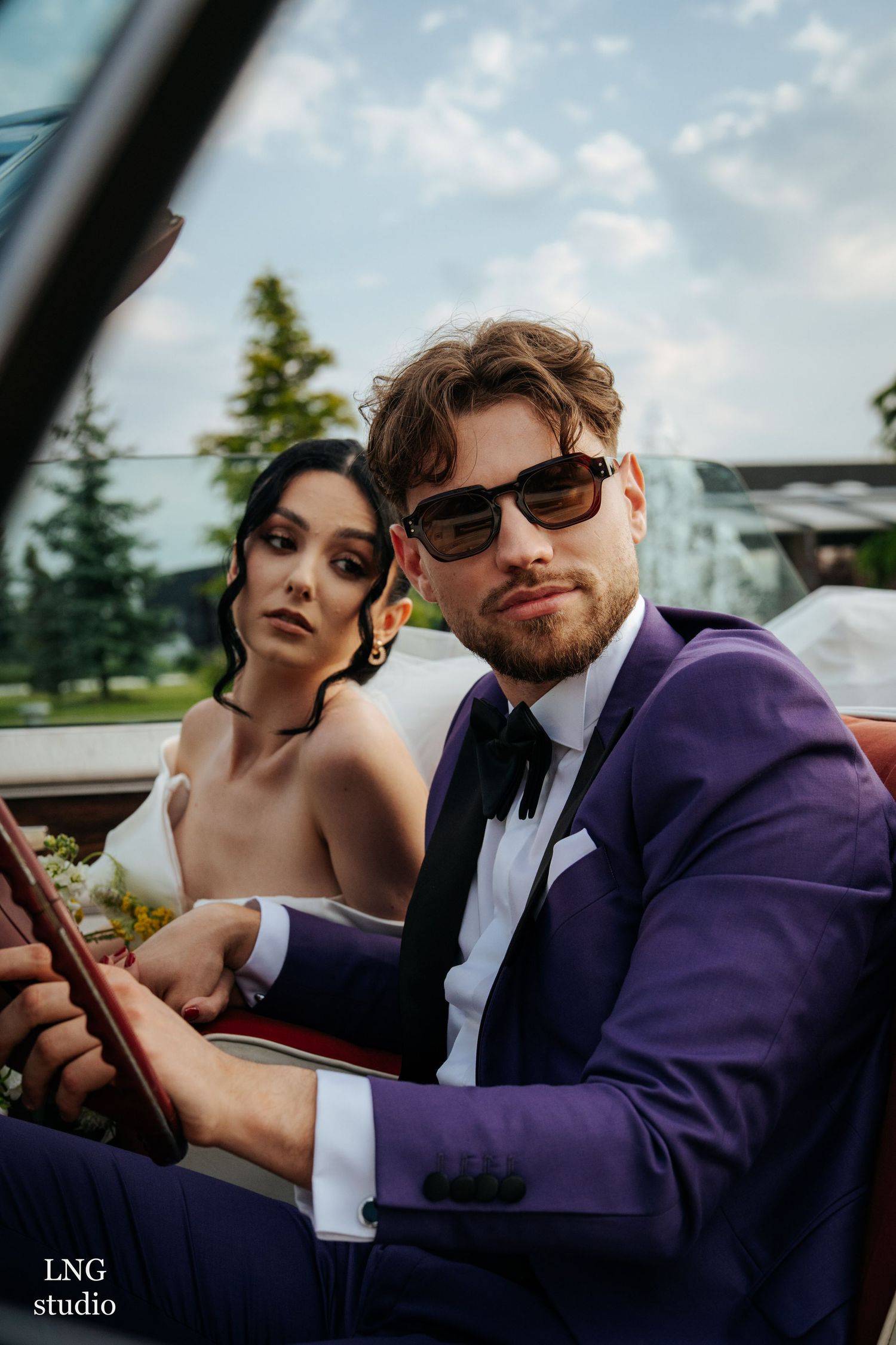 Artistic wedding photography sequence showing a couple in a classic car under a blue sky.