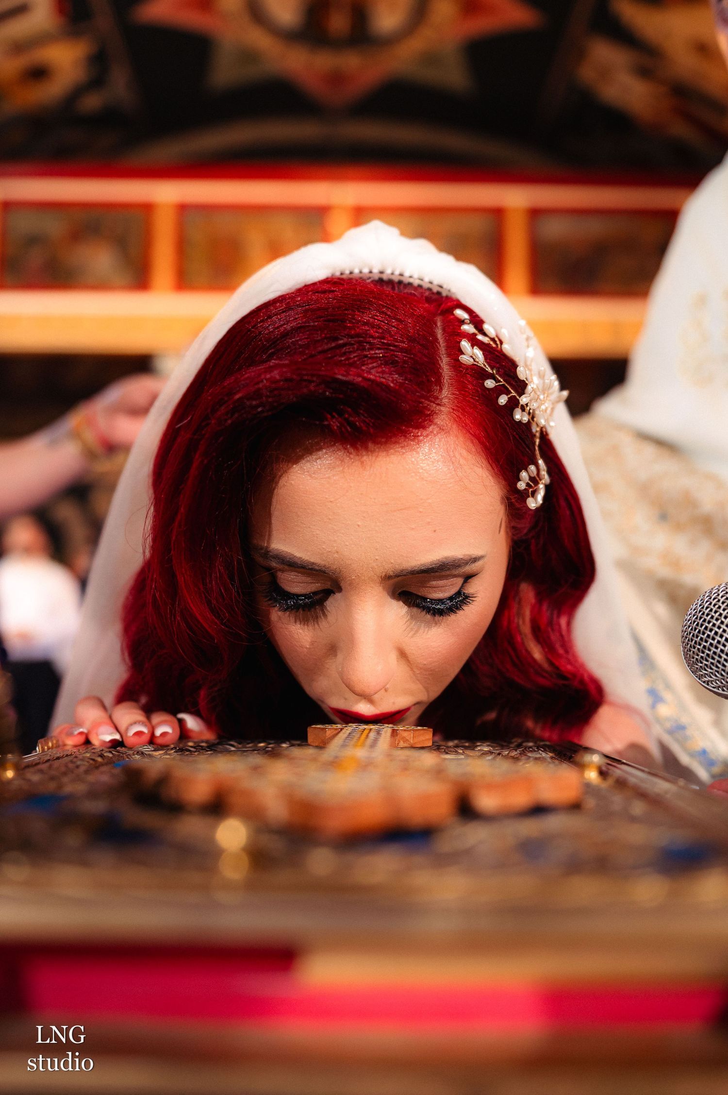 A series of artistic close-up shots showing red hair and table details at a wedding reception.