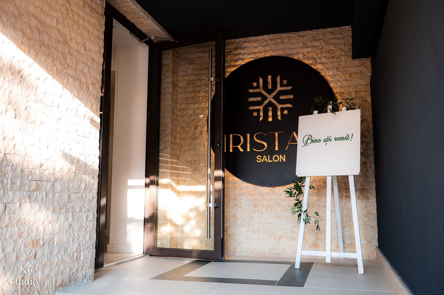 Modern minimalist interior space with white walls and decorative signage.