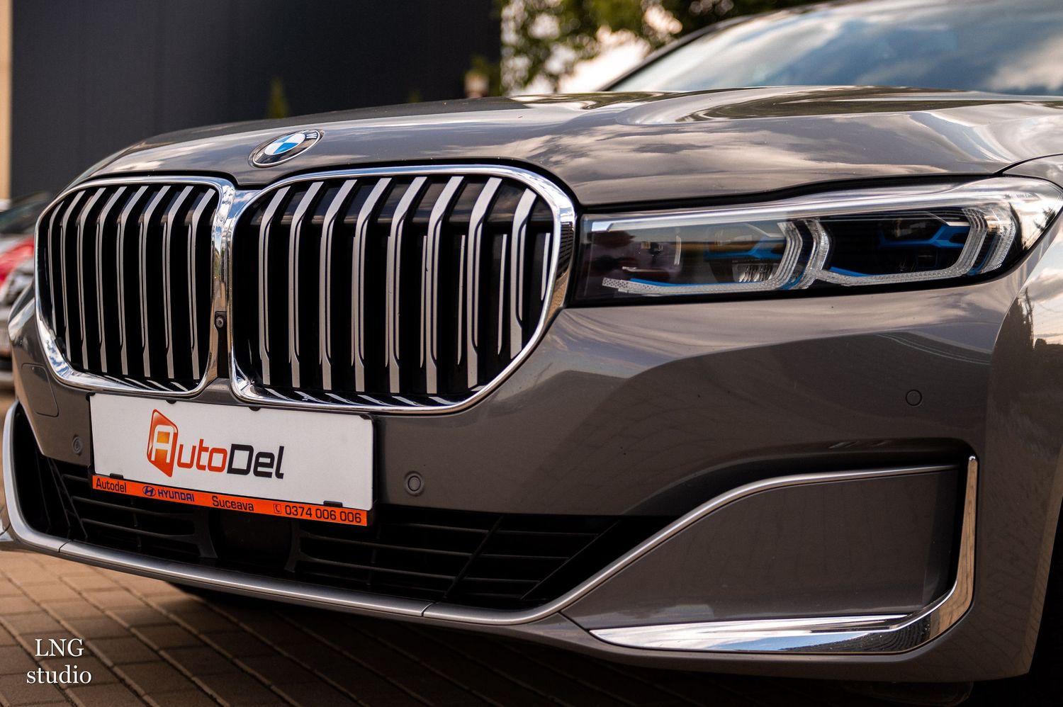 Collection of luxury BMW car front grilles and headlights showcasing the iconic kidney grille design details.
