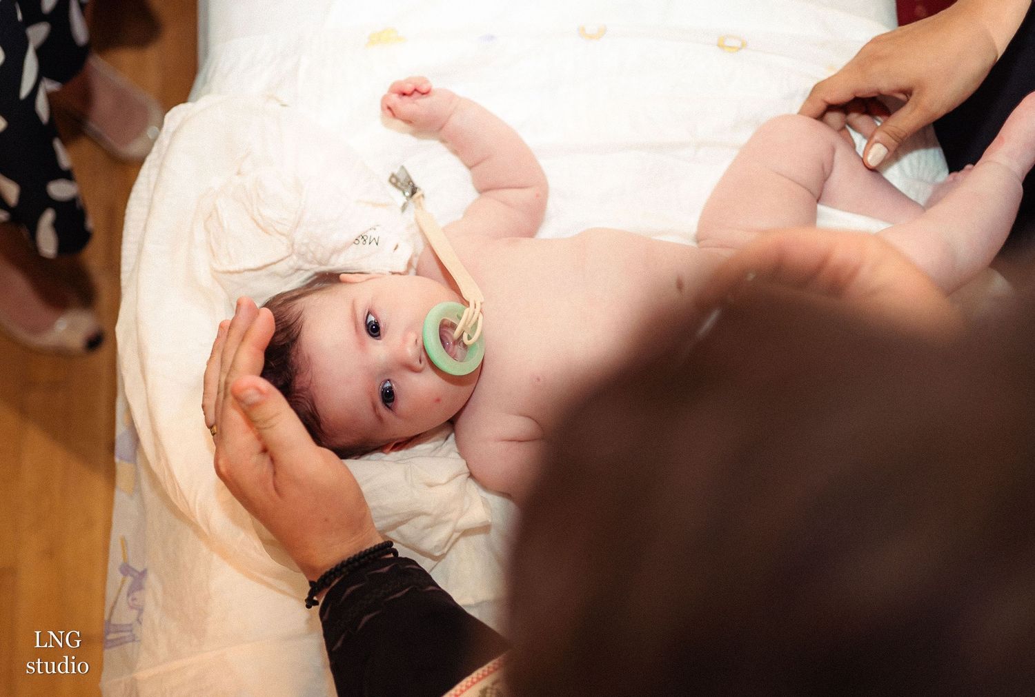 Baby during traditional baptism ceremony.
