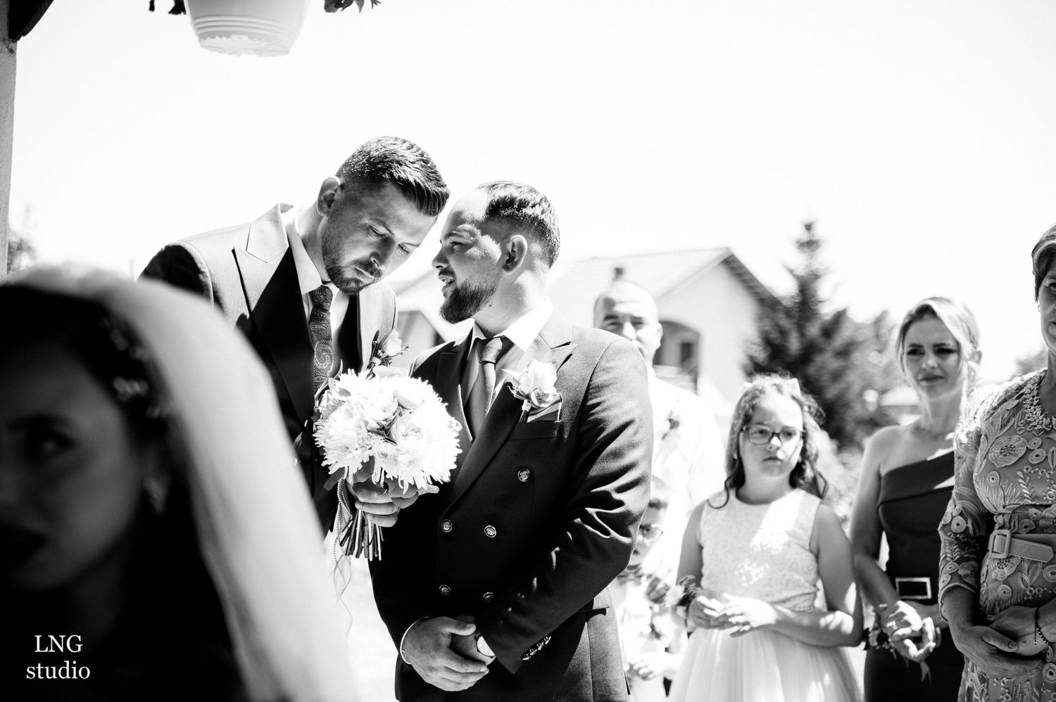 Black and white candid moments from wedding ceremony celebrations.