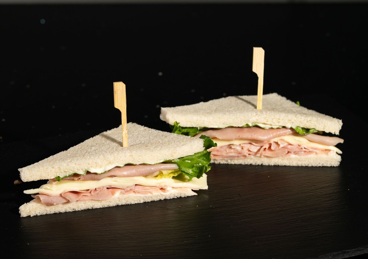 Classic white bread sandwich with meat and lettuce photographed in sequence.