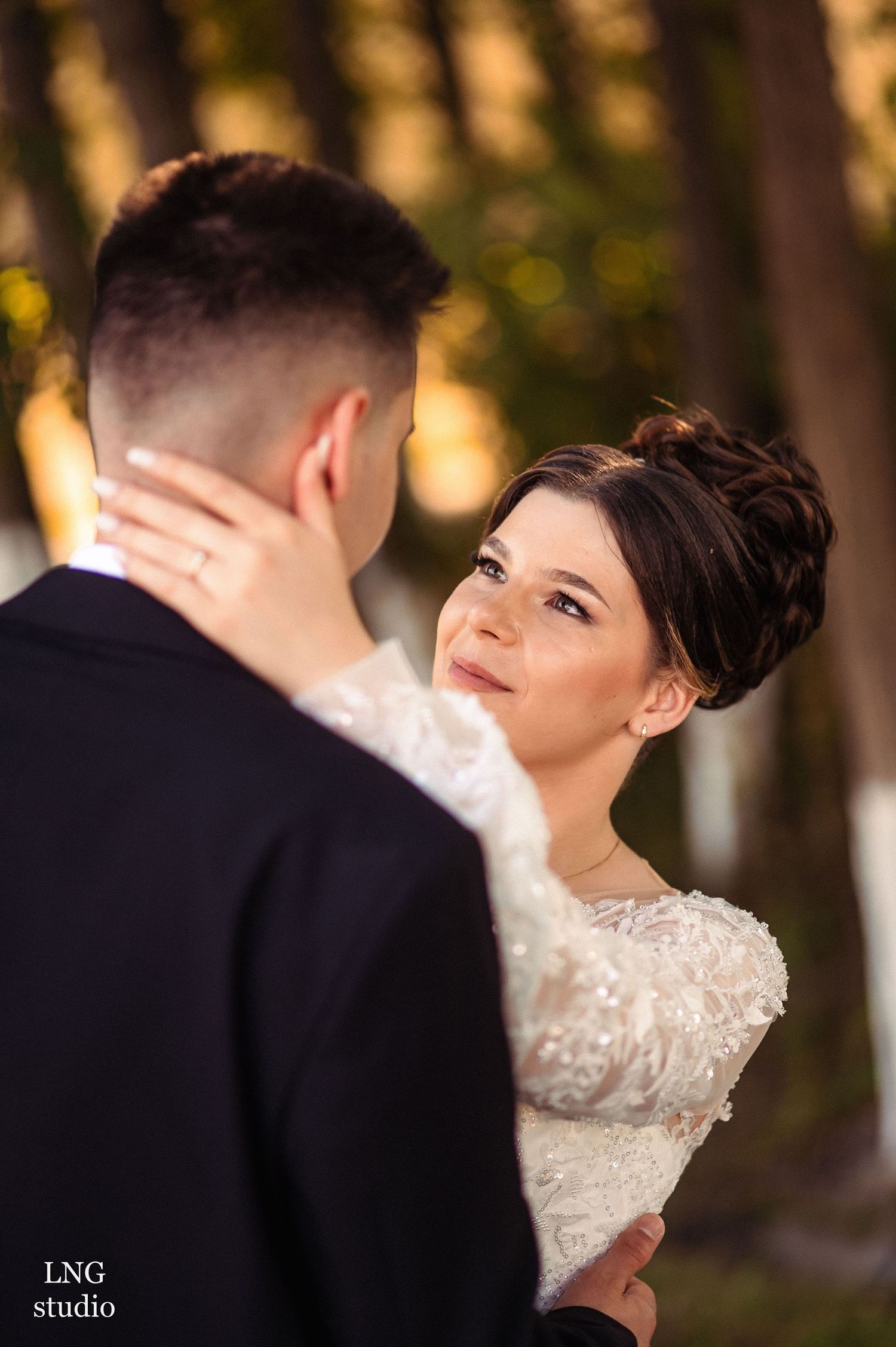Intimate wedding portrait showing tender moment between bride and groom.