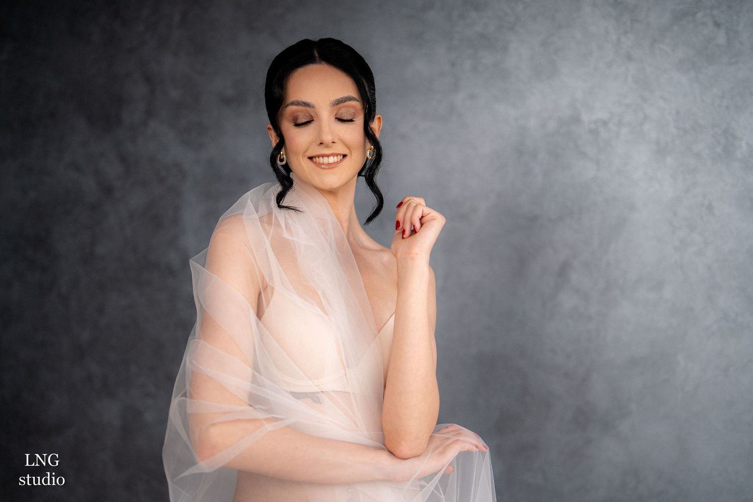Five studio portraits in white against dark gray background showing movement with flowing tulle fabric and soft lighting.