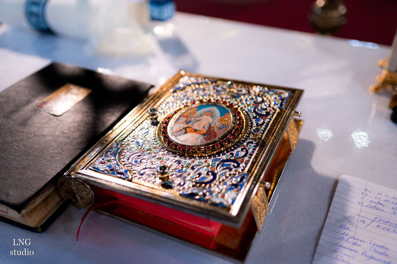 Ornate religious book with decorative metalwork cover and detailed embellishments.