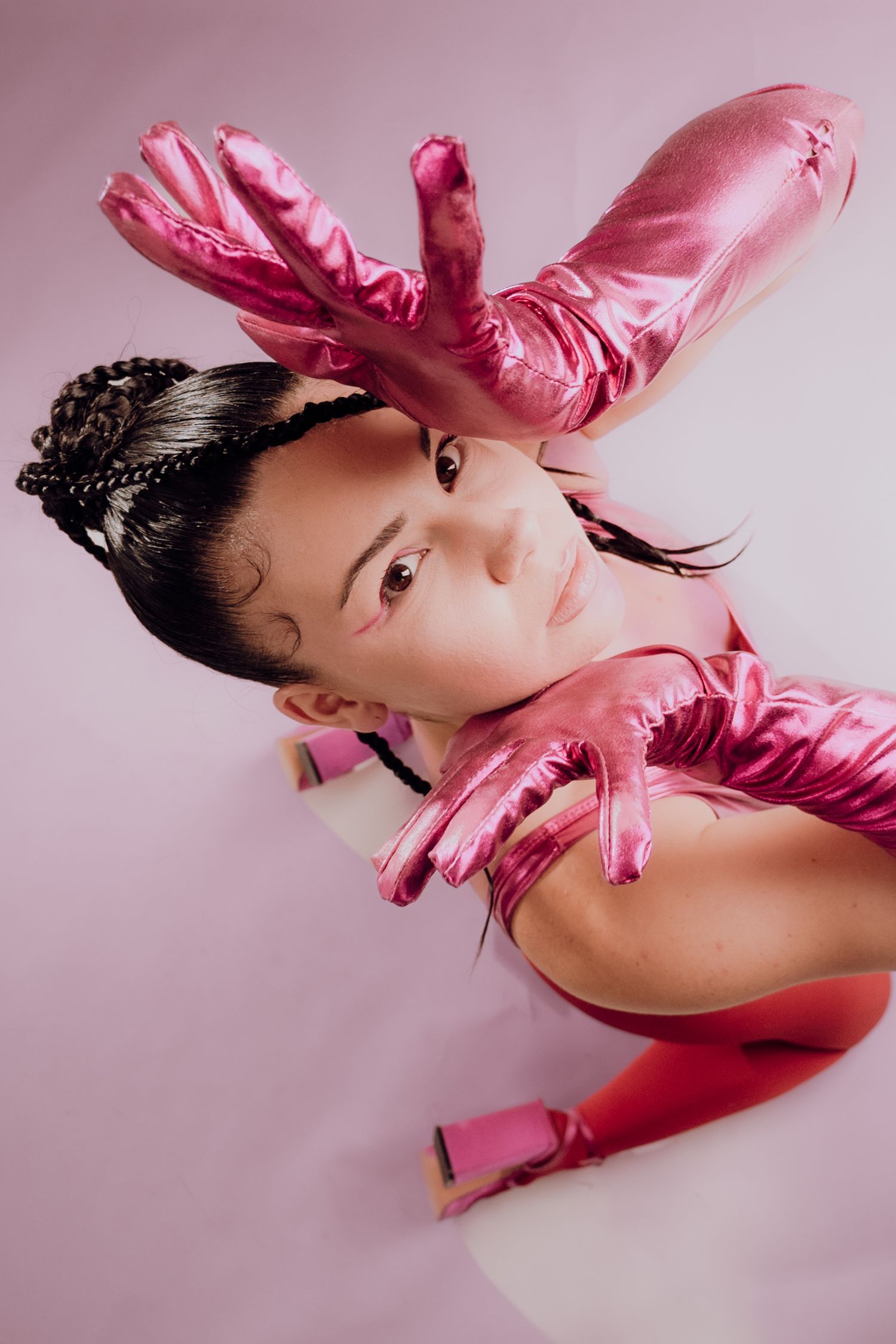 Avant-garde fashion photography featuring a woman with exaggerated gloves posing artistically – Croatia