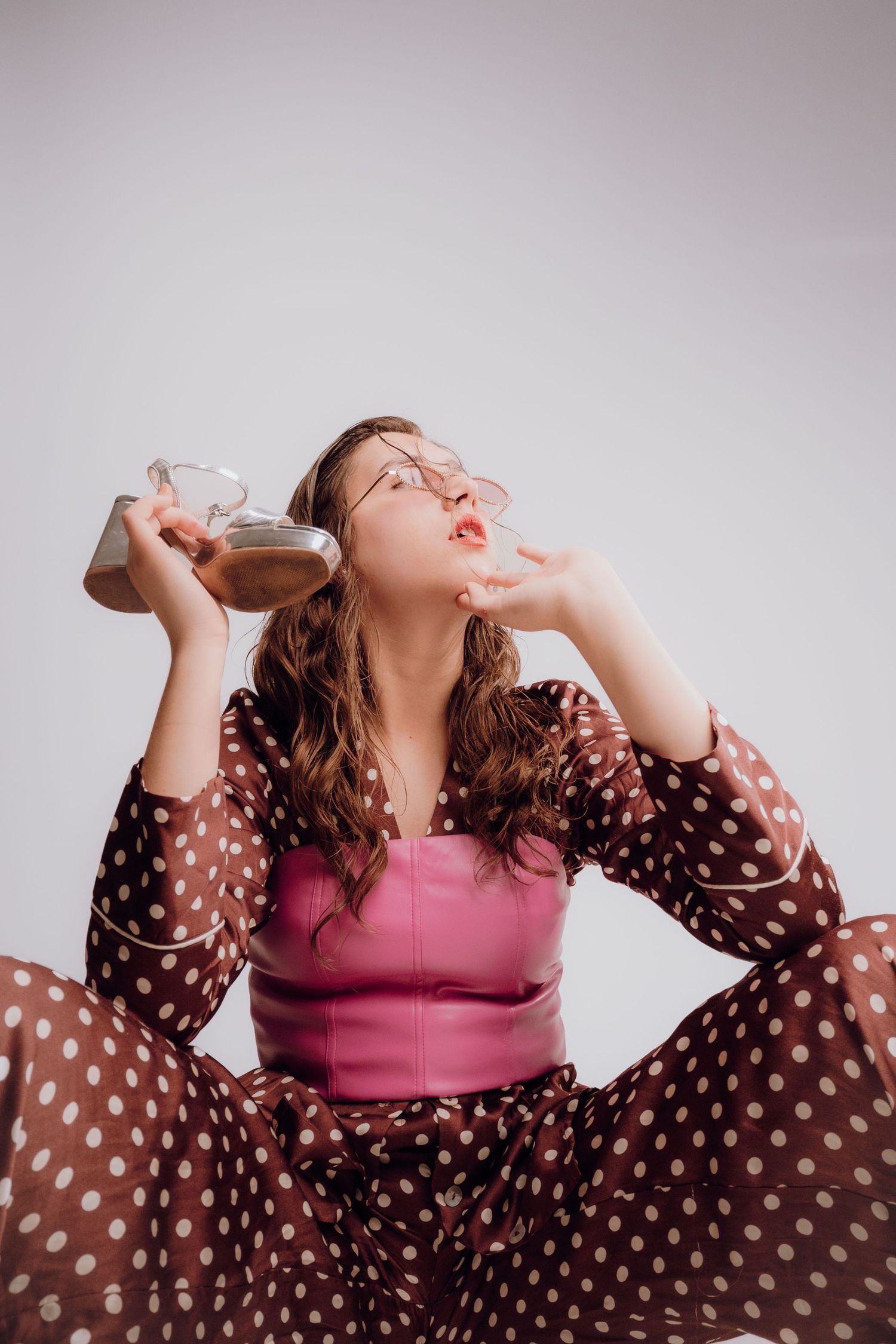 Artistic fashion portrait of a woman using a stiletto as a prop – Croatia