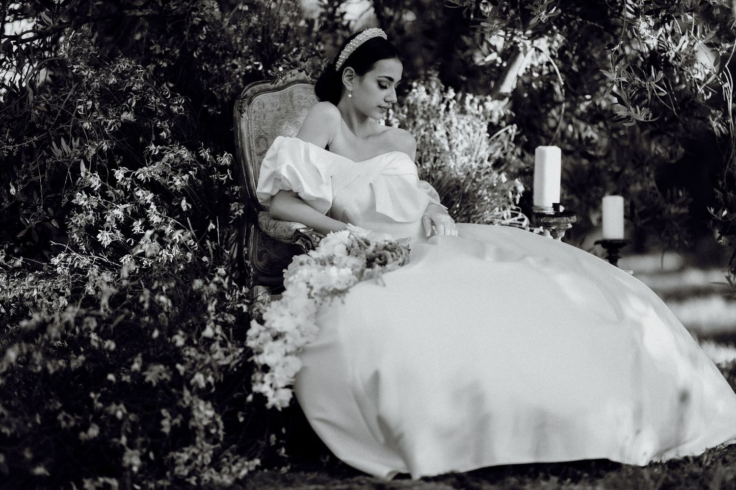 Elegant bride in wedding dress surrounded by olive trees in Istria