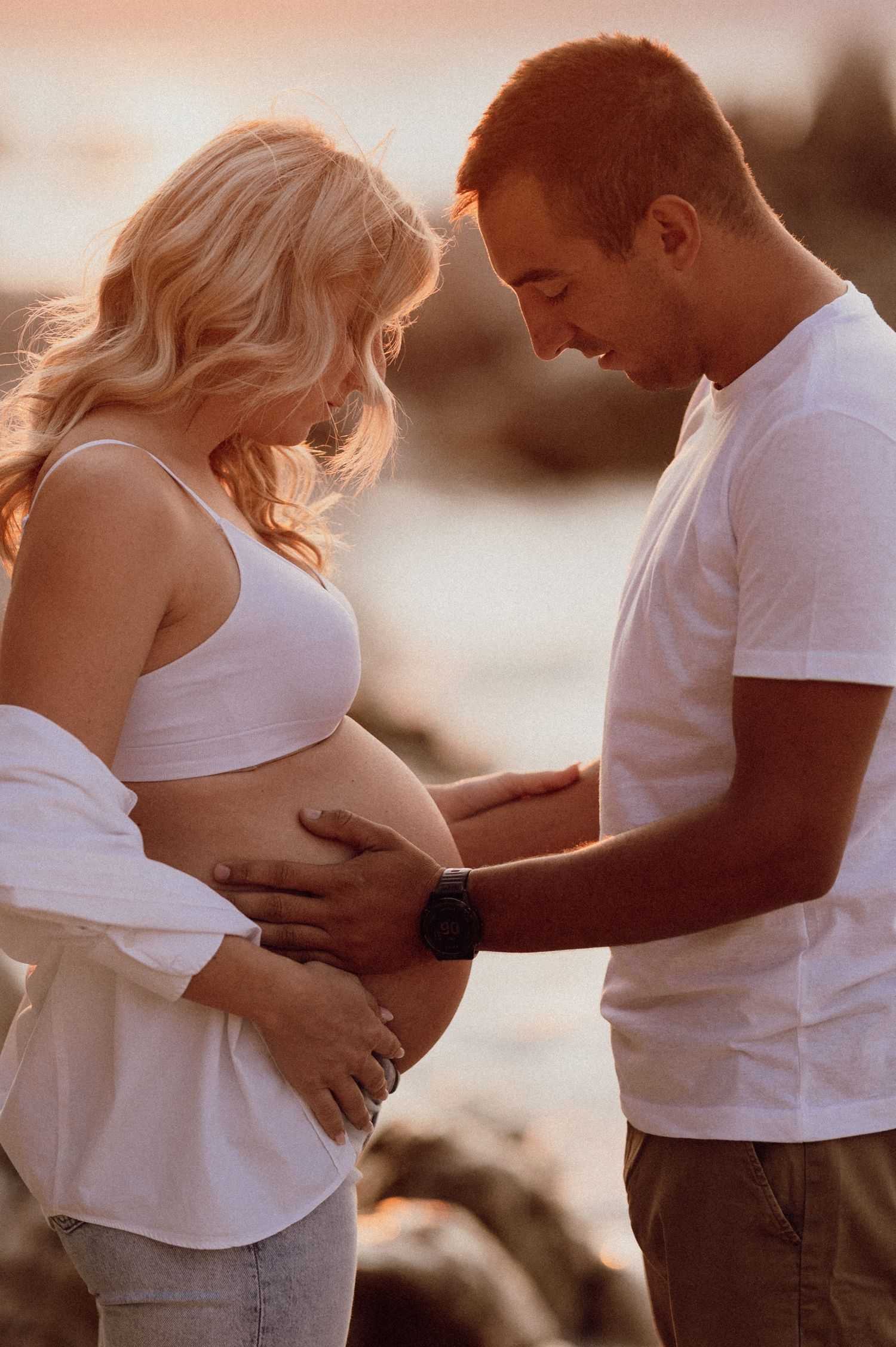 Couple awaiting their baby on a quiet sunrise beach – maternity photography, Istria