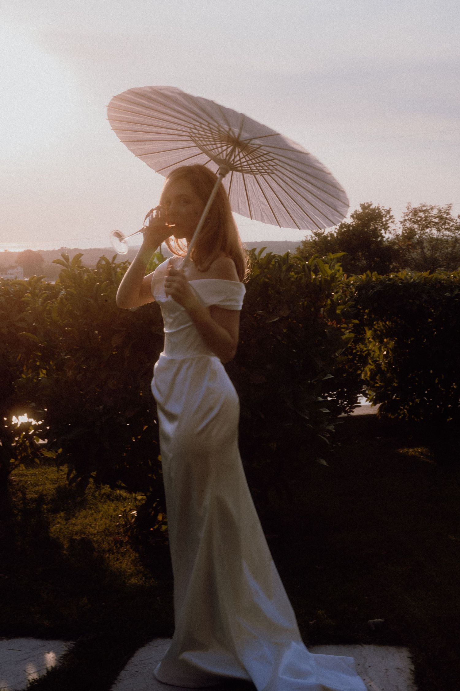 Bride enjoying a sunset moment with champagne – Restaurant & Villa Morgan, Istra, Croatia