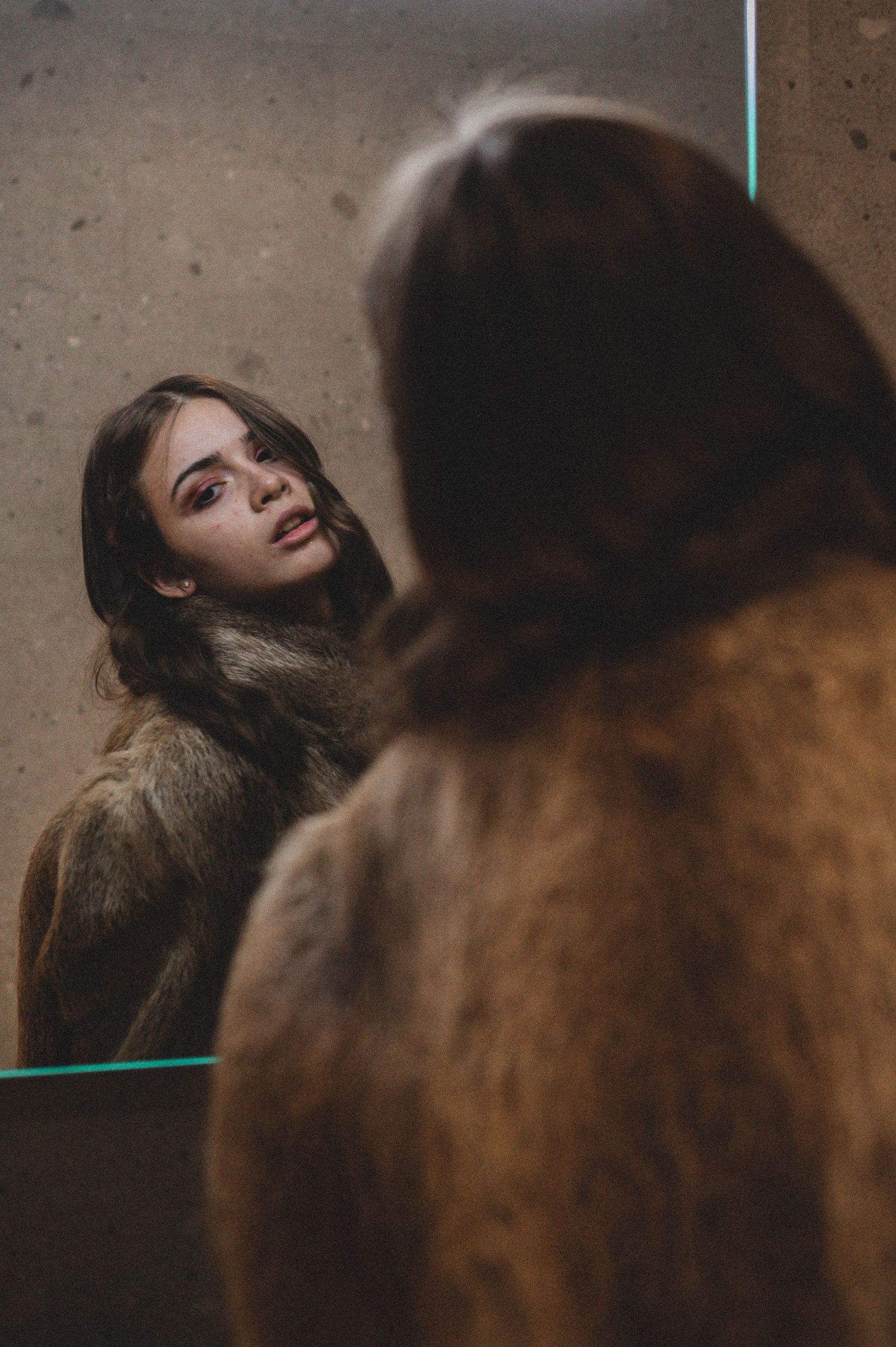 Elegant fashion portrait of a model in a fur coat  – Croatia