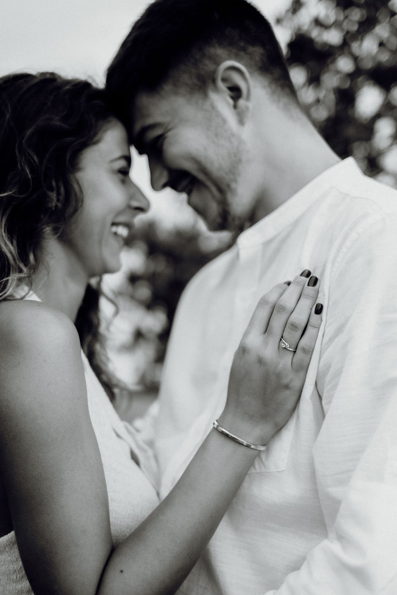 Engaged couple sharing a romantic moment outdoors during their photoshoot, Croatia