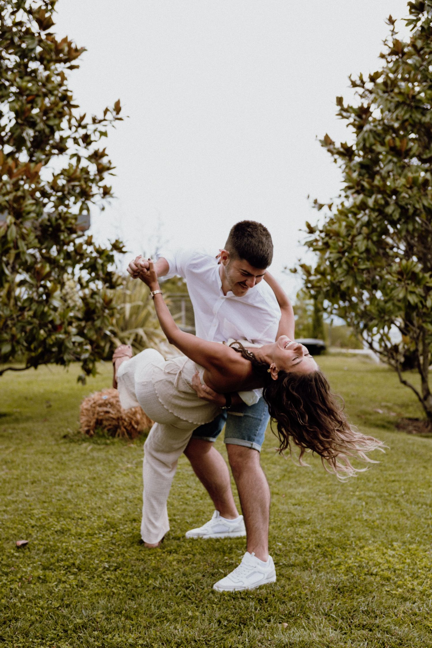Couple showing their engagement rings during a joyful photoshoot, Croatia