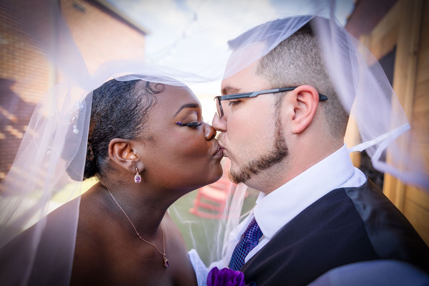 Romantic wedding photography with soft lighting and purple accents.