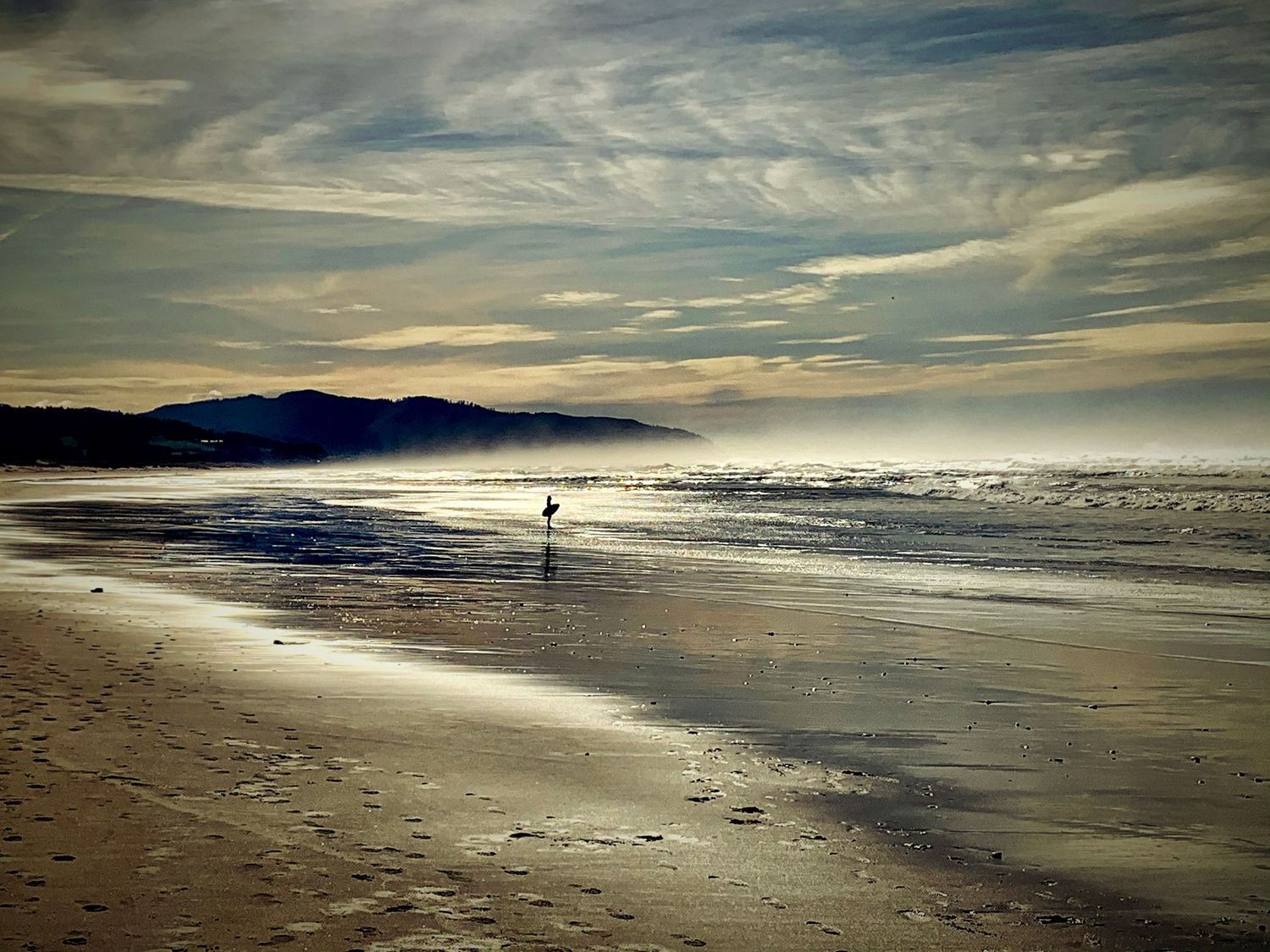 Lone surfer in Pacific City, OR