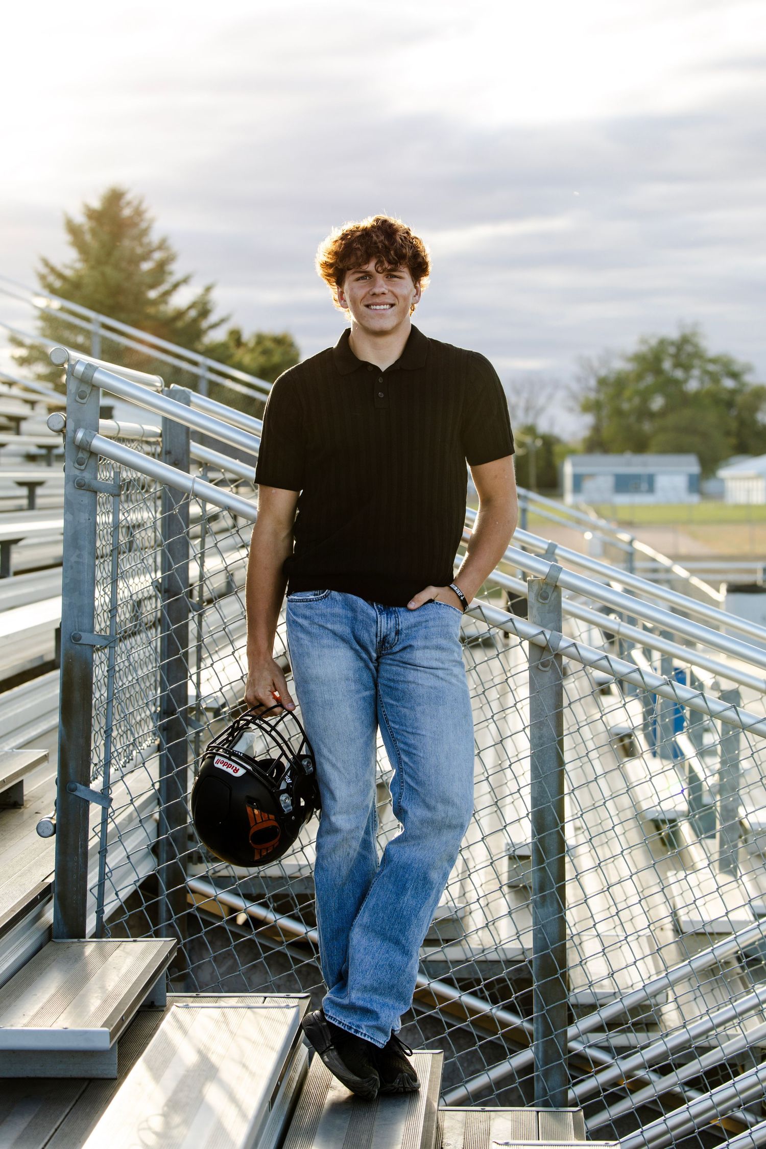 senior picture with football helmet