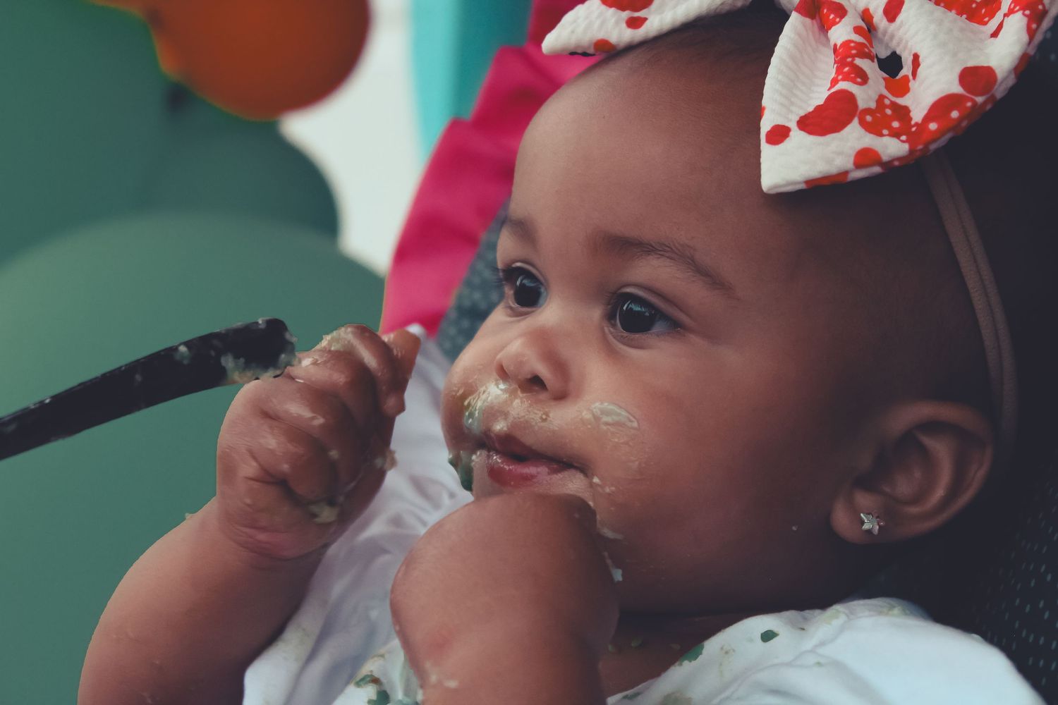 1 year old eating cake