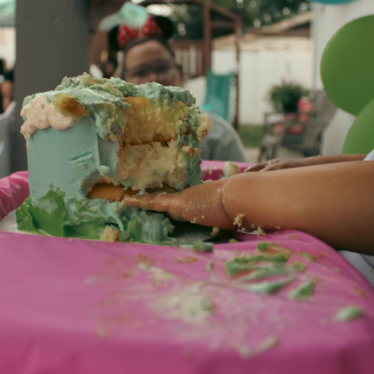 1 year old eating cake