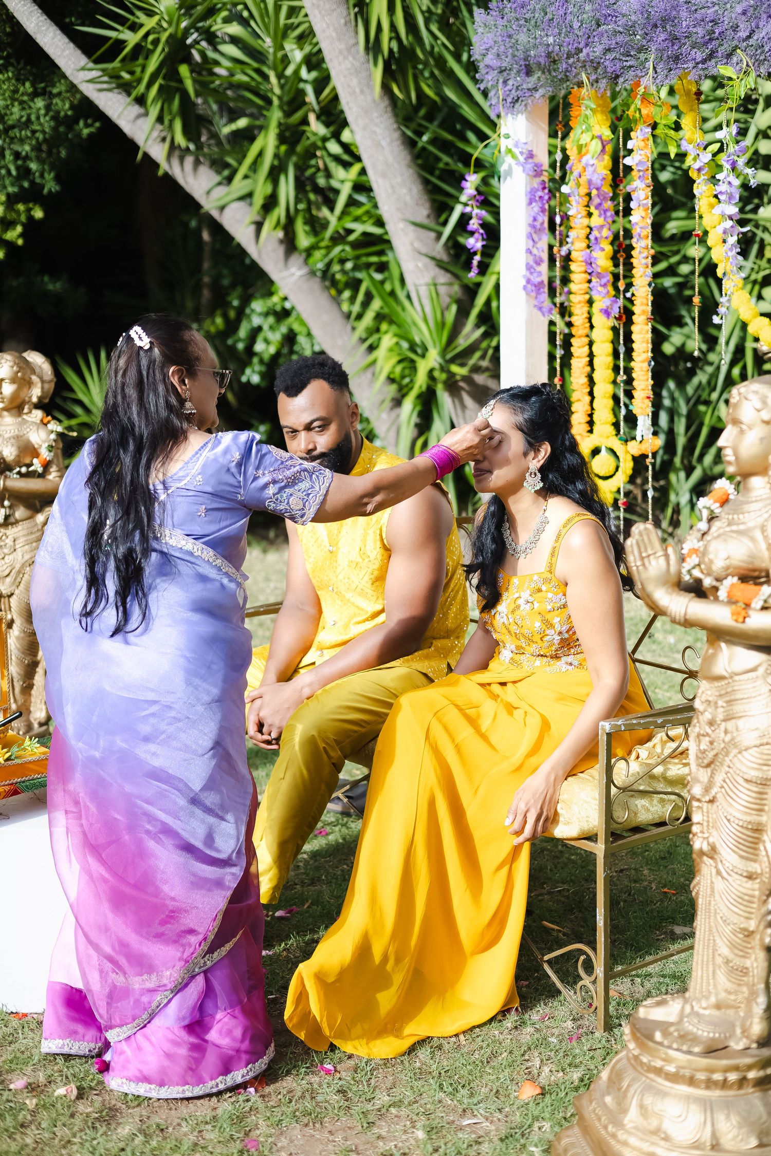 A sequence of photos showing traditional Indian pre-wedding haldi ceremony with yellow and purple attire in an outdoor setting.