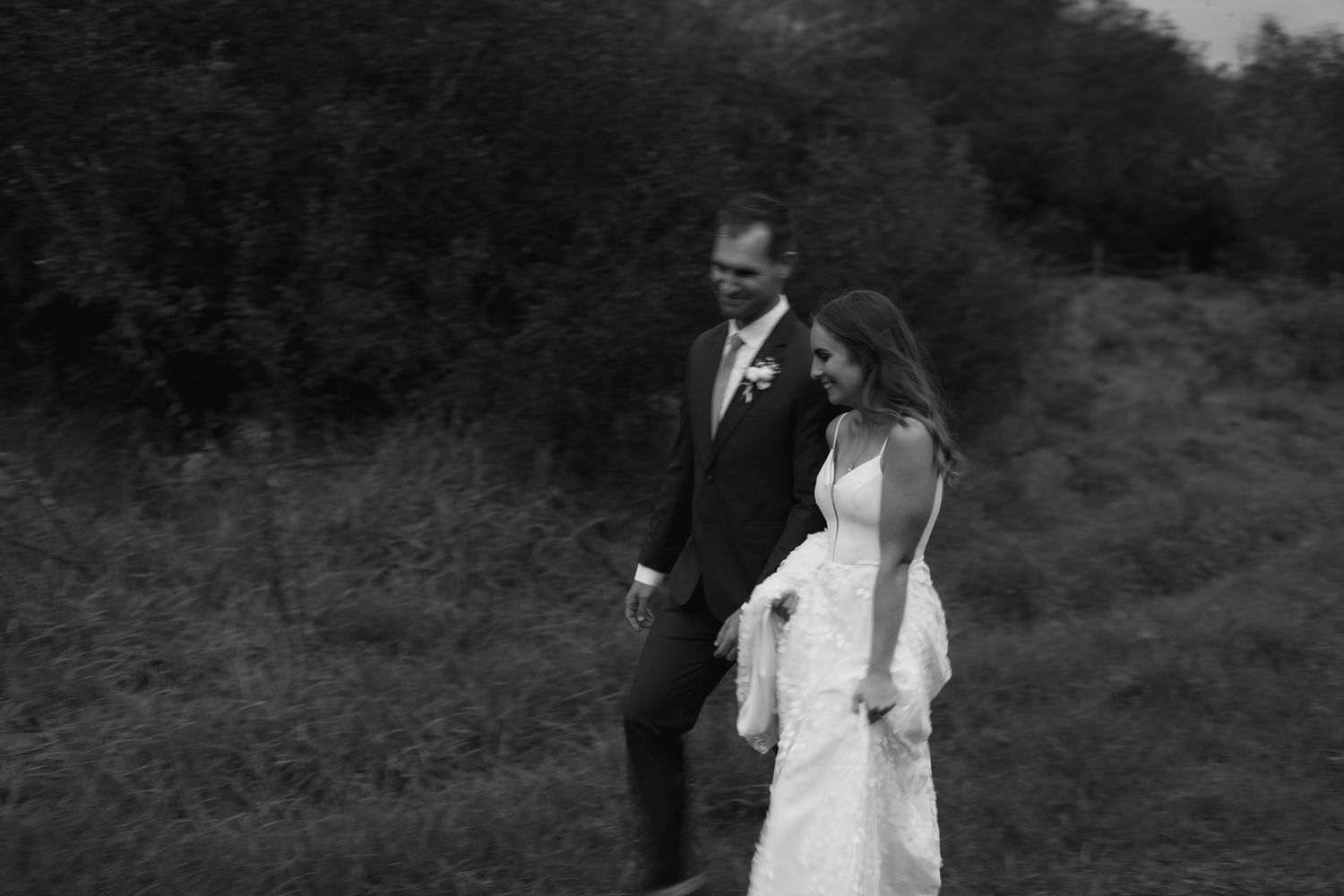 Dramatic black and white wedding photos against a mountain landscape.