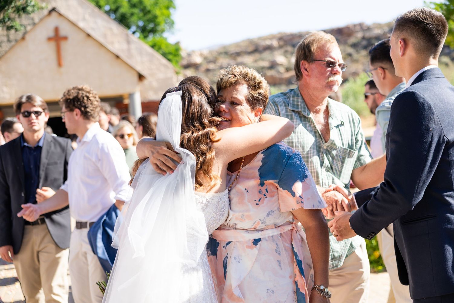 Candid moments of celebration and joy at an outdoor wedding reception.
