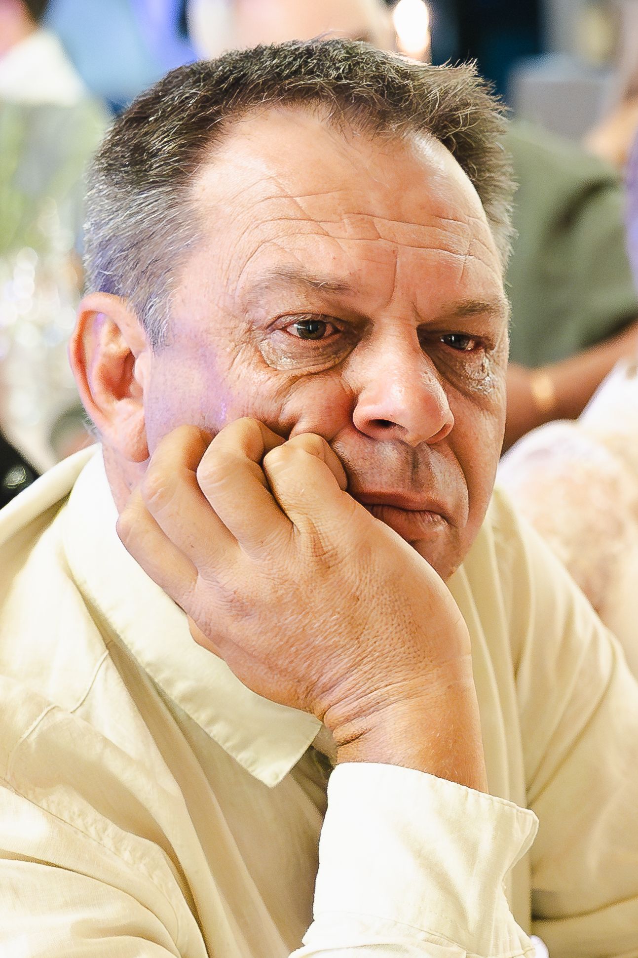 Series of emotional expressions from a person wearing a light colored shirt.