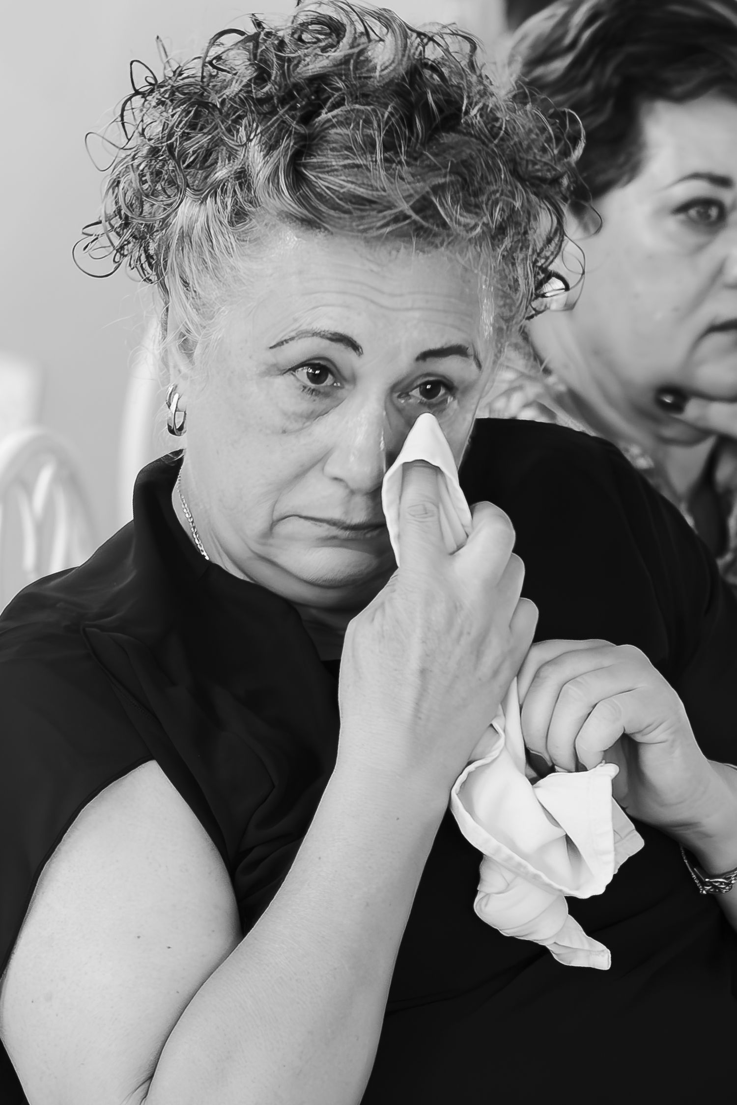 Sequence showing emotional expressions with tissues being used to wipe tears.