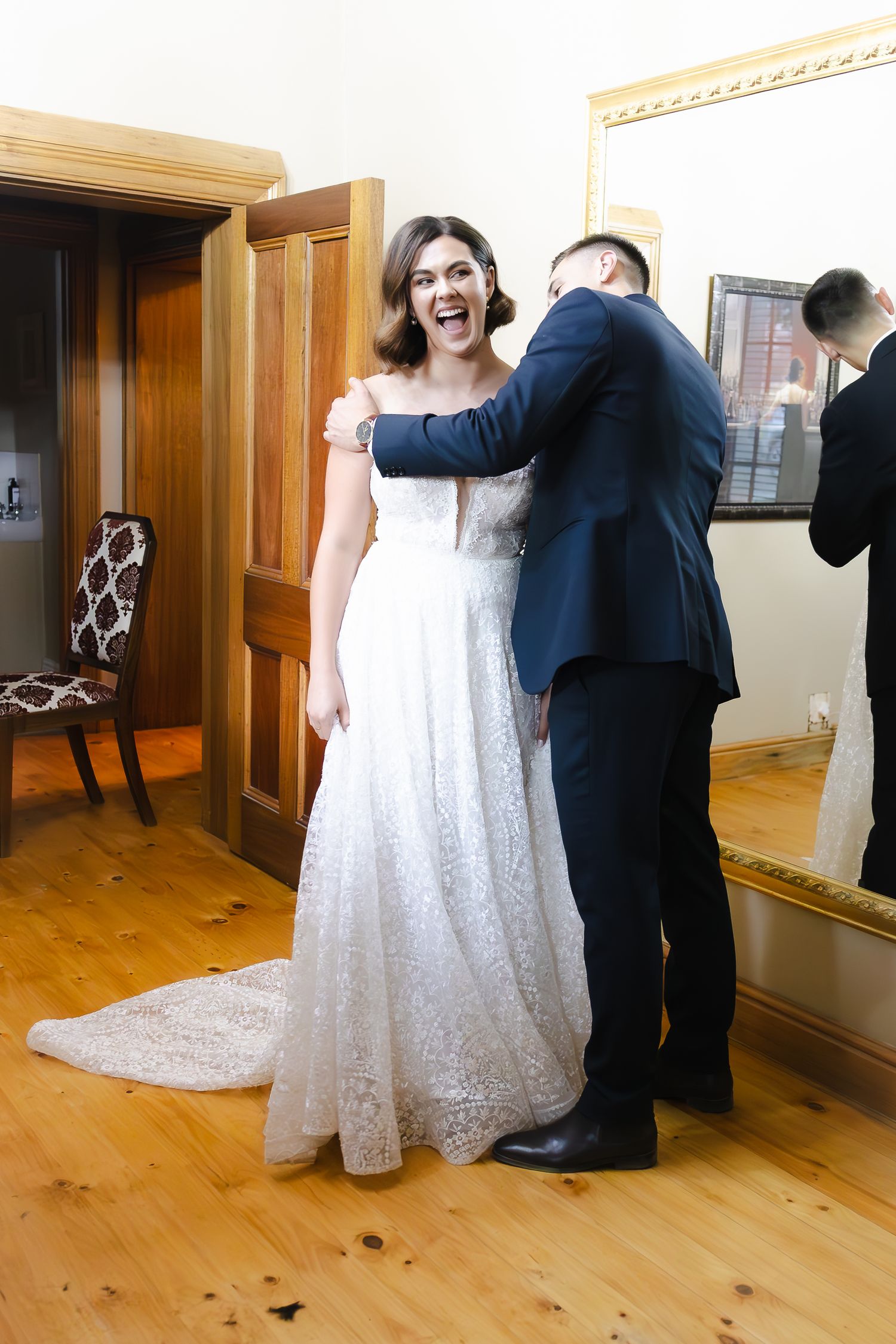 A series of photos showing a couple in wedding attire dancing together on a wooden floor in an indoor venue.
