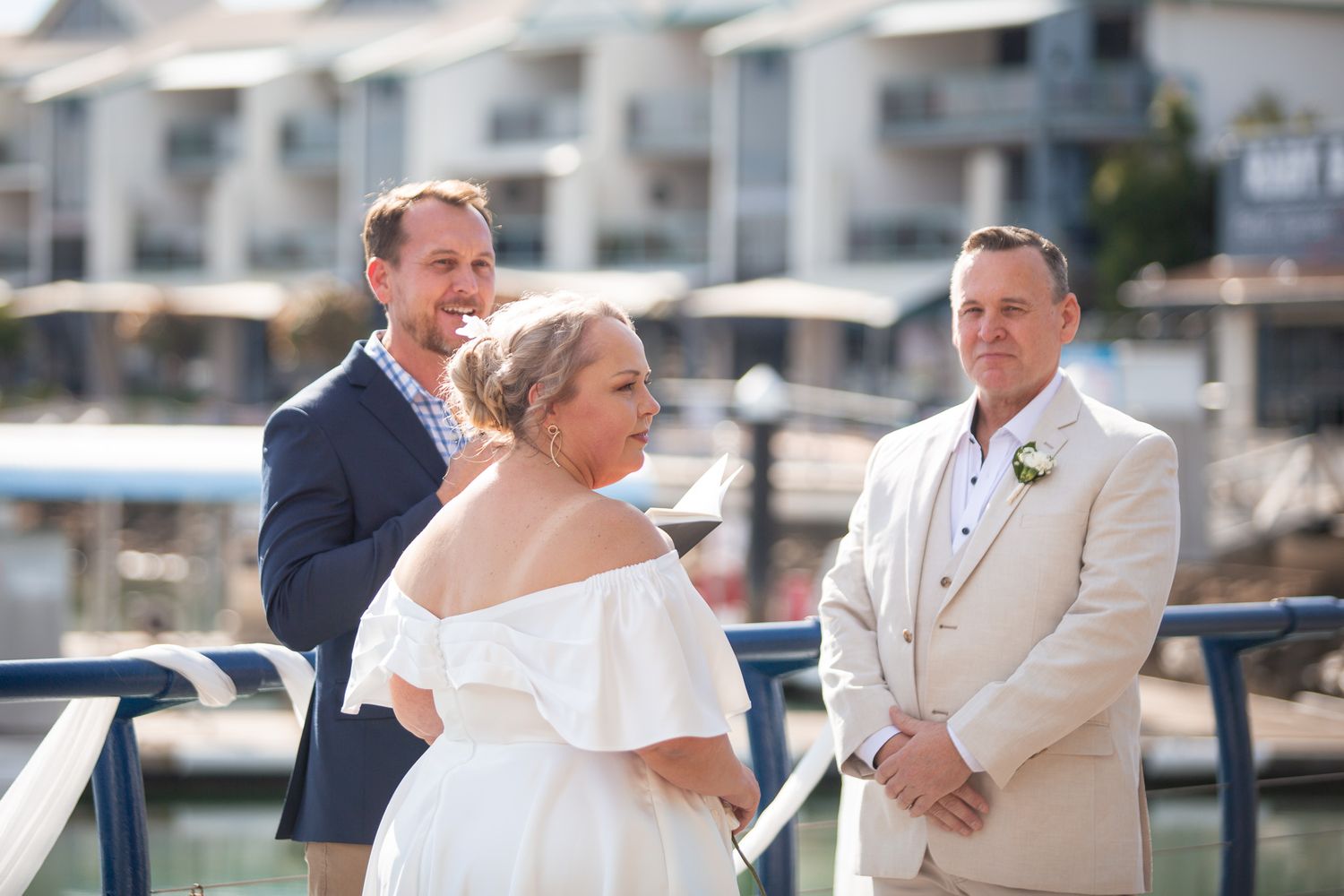 a couple look lovingly at each other while posing for a photo at their vow renewal