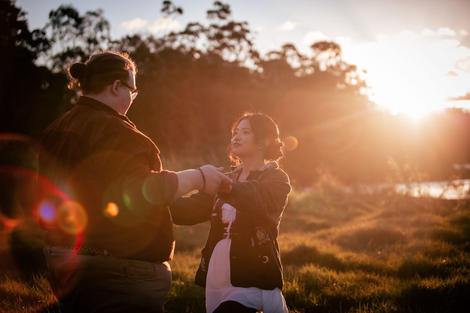 a couple look lovingly at each other at their playful pre wedding photoshoot