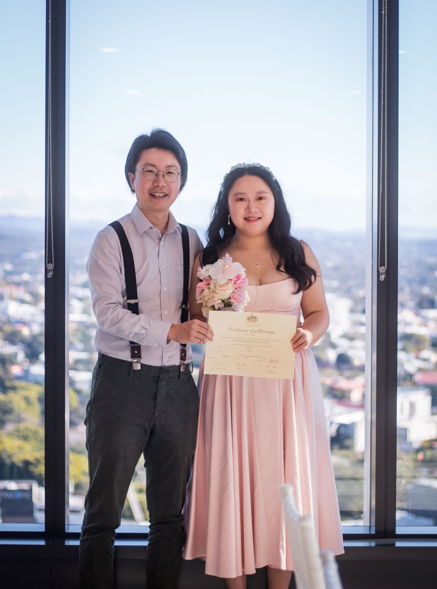 a couple pose for photos on their wedding day