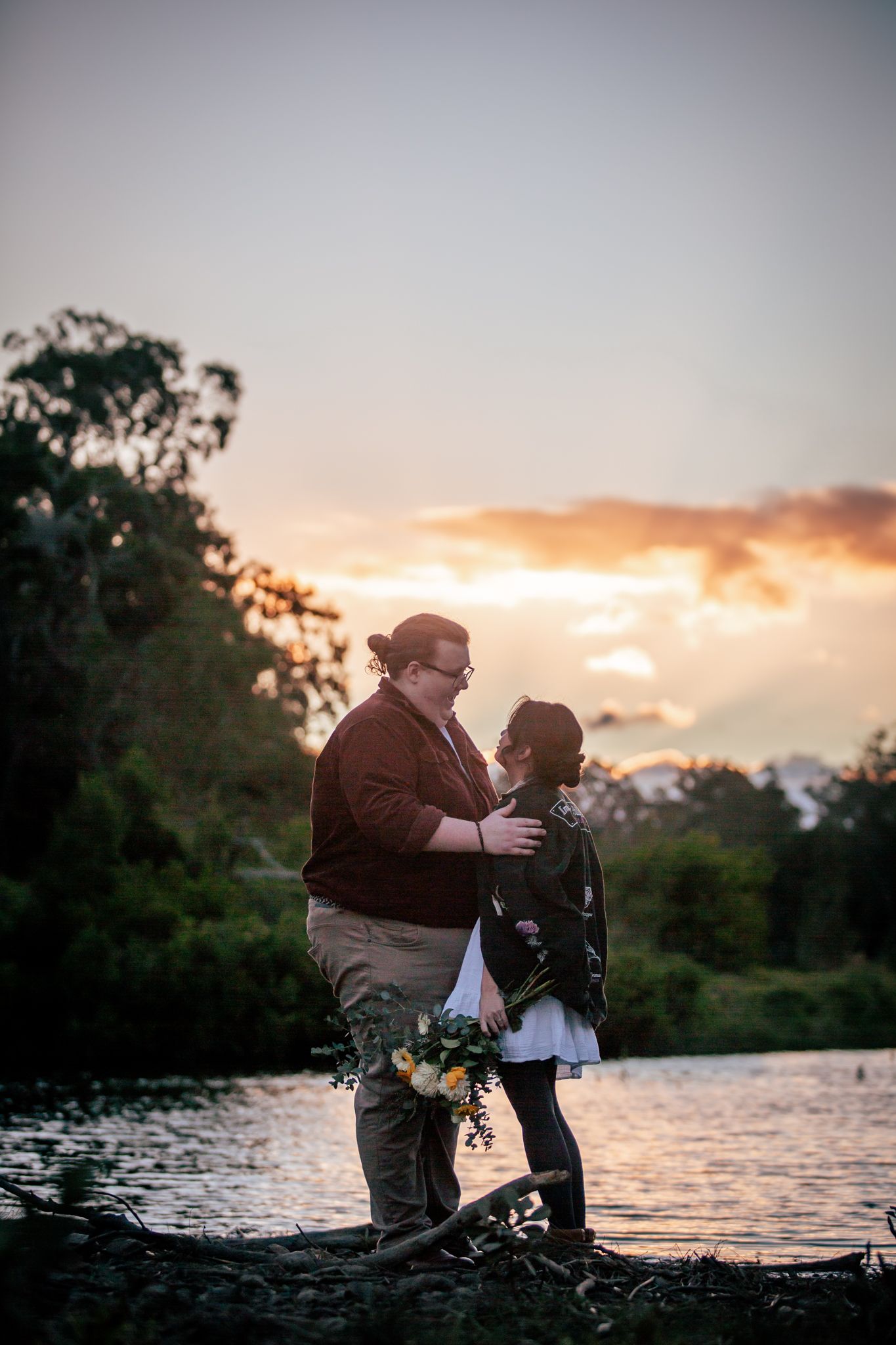 a couple look lovingly at each other at their pre wedding photoshoot