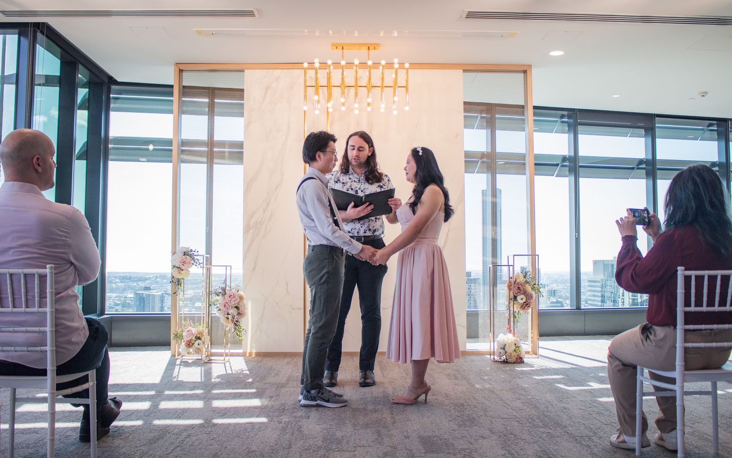 a photo of a couple at the ceremony on their wedding day