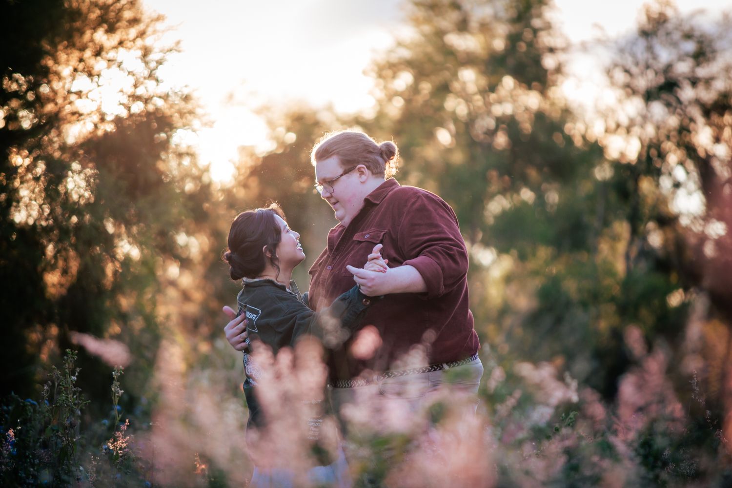 a couple look lovingly at each other at their playful pre wedding photoshoot
