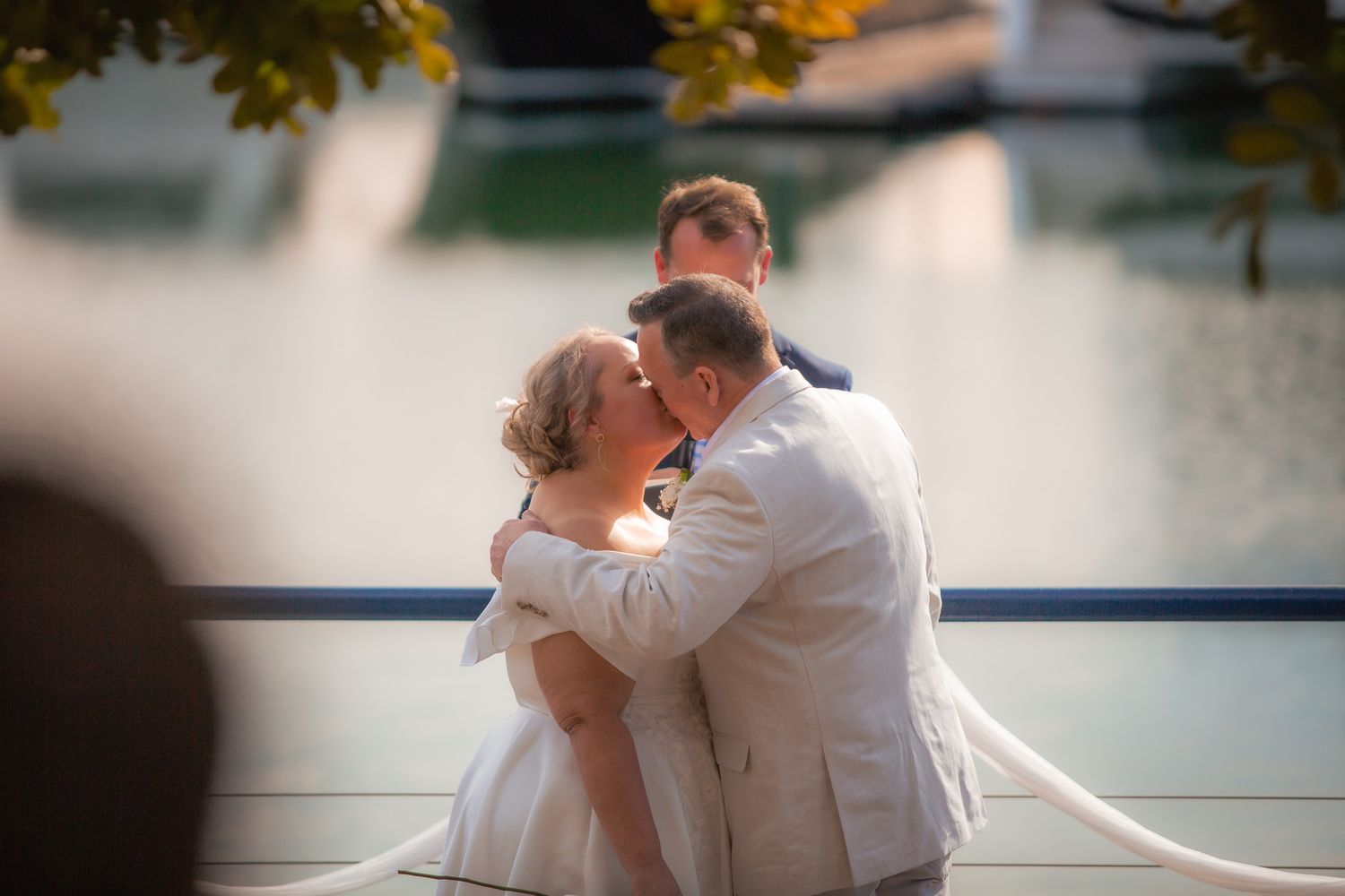 a couple look lovingly at each other while posing for a photo at their vow renewal