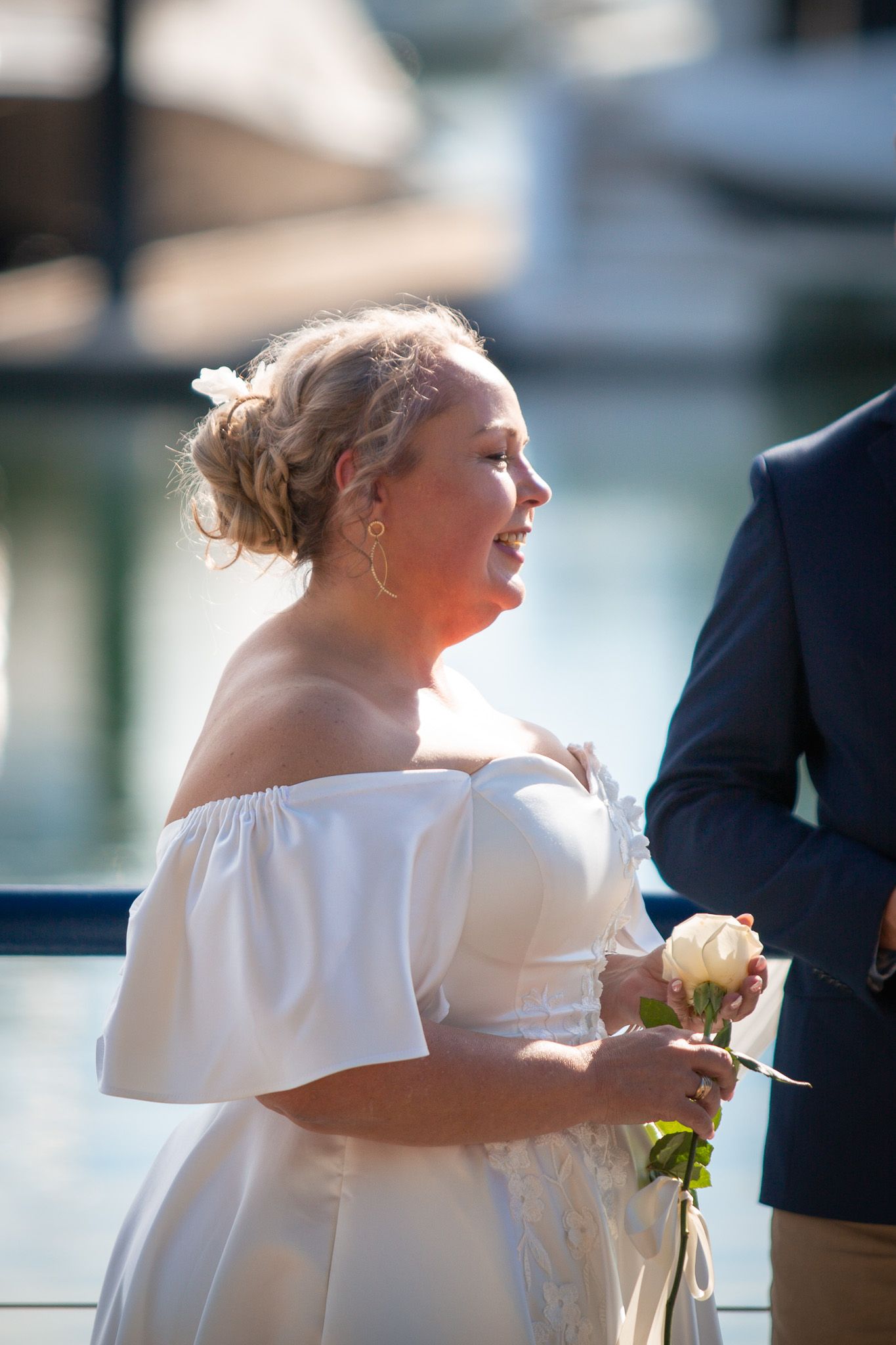 a couple look lovingly at each other while posing for a photo at their vow renewal