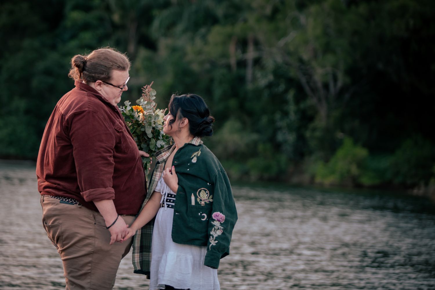 a couple look lovingly at each other at their pre wedding photoshoot