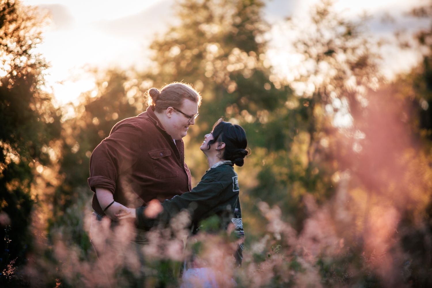 a couple look lovingly at each other at their playful pre wedding photoshoot