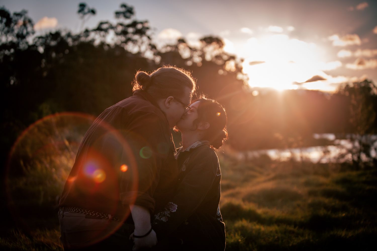 a couple look lovingly at each other at their playful pre wedding photoshoot