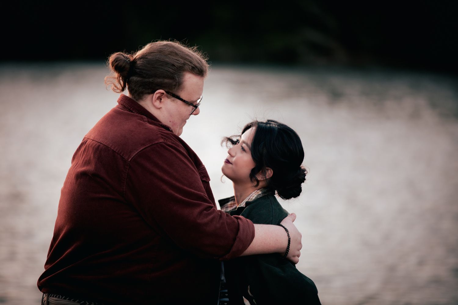 a couple look lovingly at each other at their pre wedding photoshoot