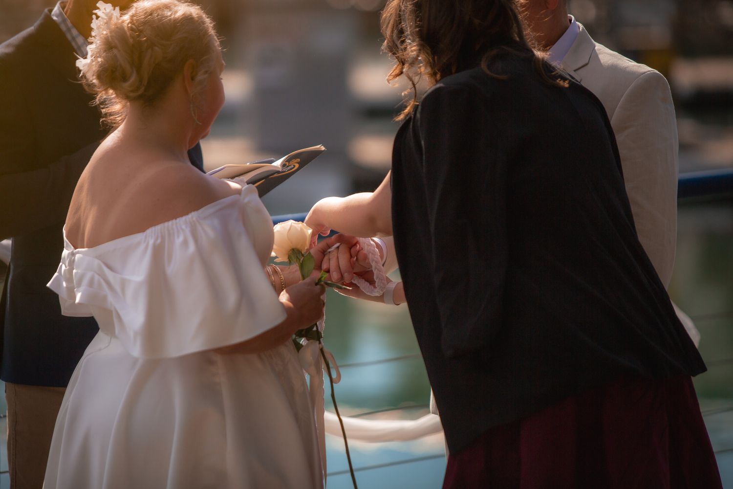 a couple look lovingly at each other while posing for a photo at their vow renewal