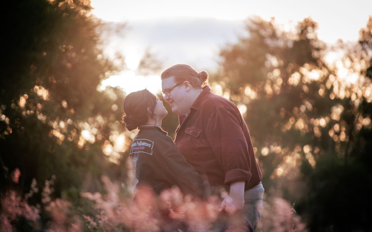 a couple look lovingly at each other at their playful pre wedding photoshoot