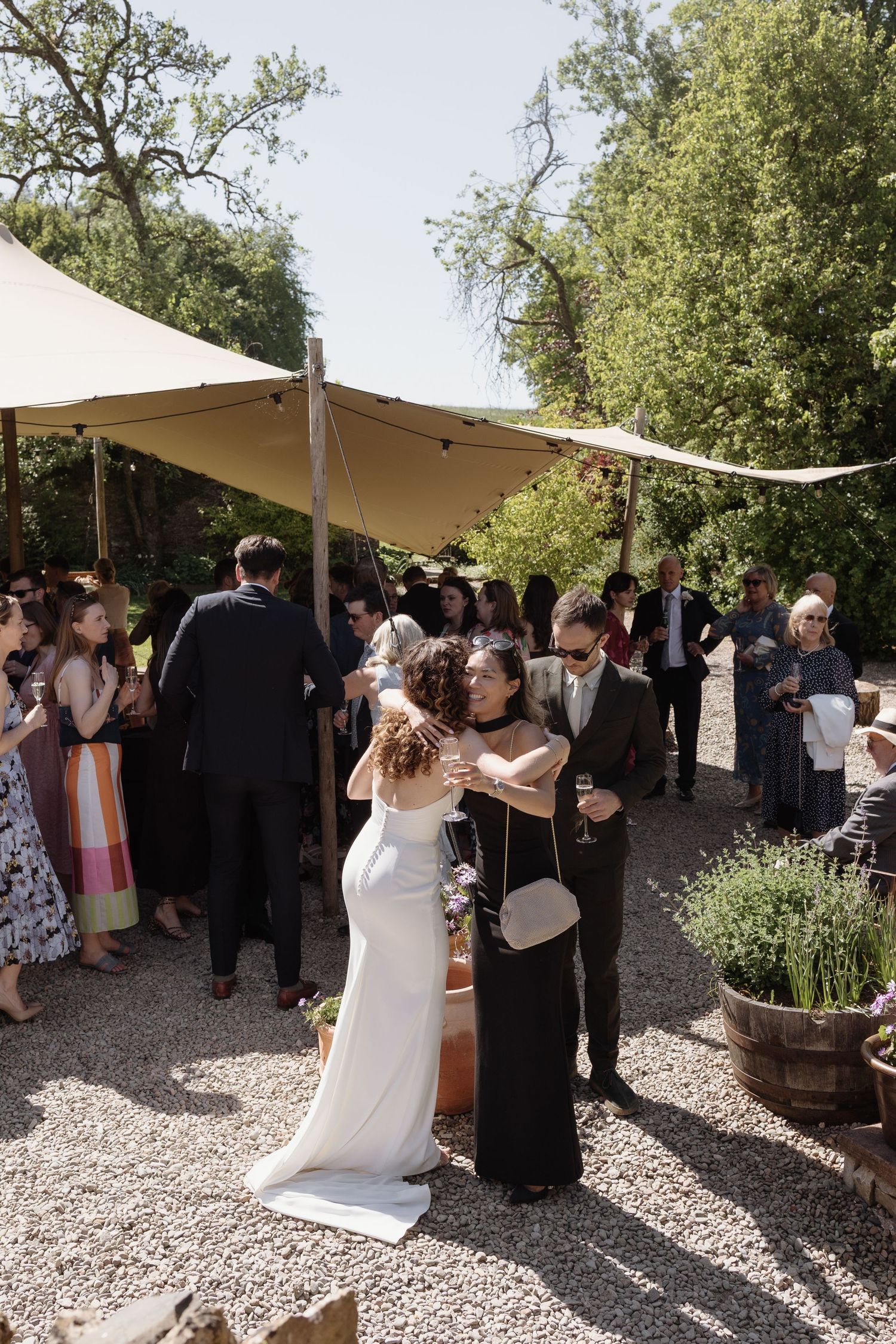 Guests enjoying champagne in the courtyard at Holesfoot