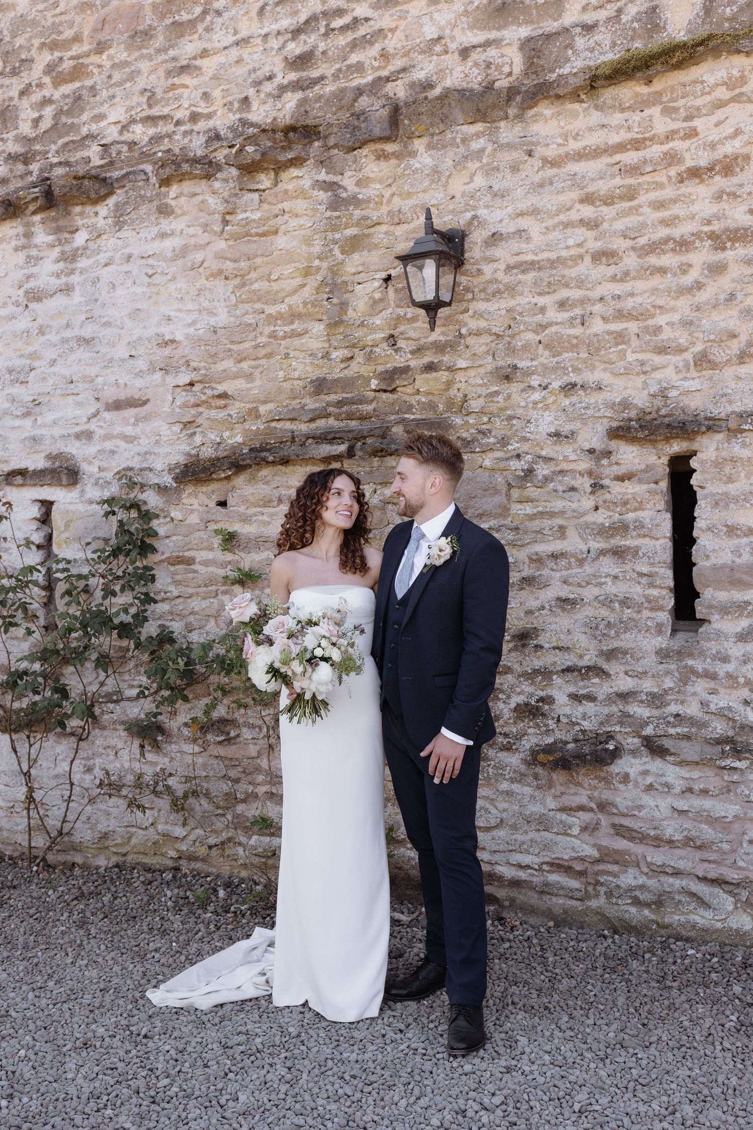 Intimate portrait beside the stone walls of Holesfoot