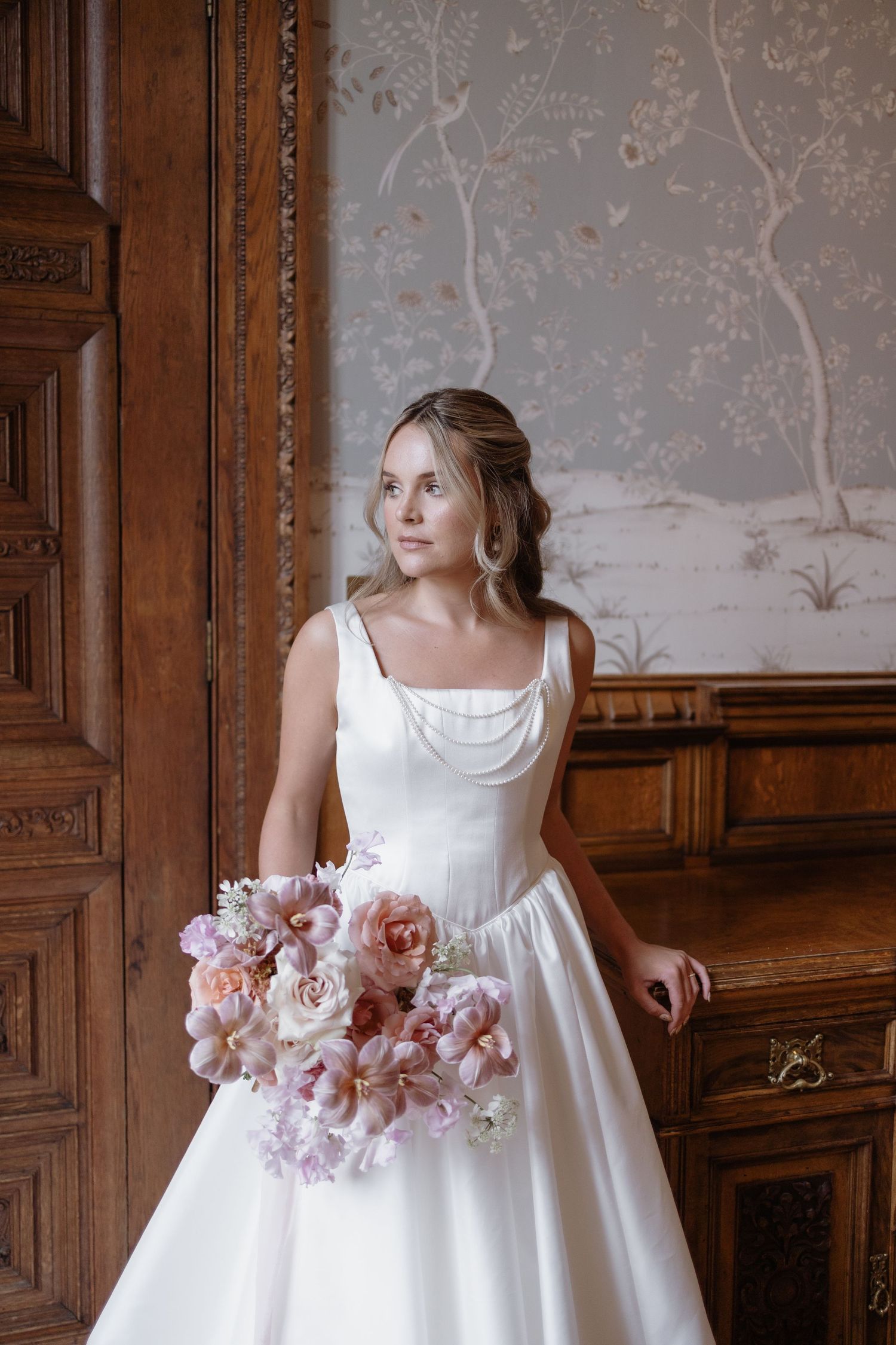 Romantic portrait by the ivy-covered walls at Soughton Hall