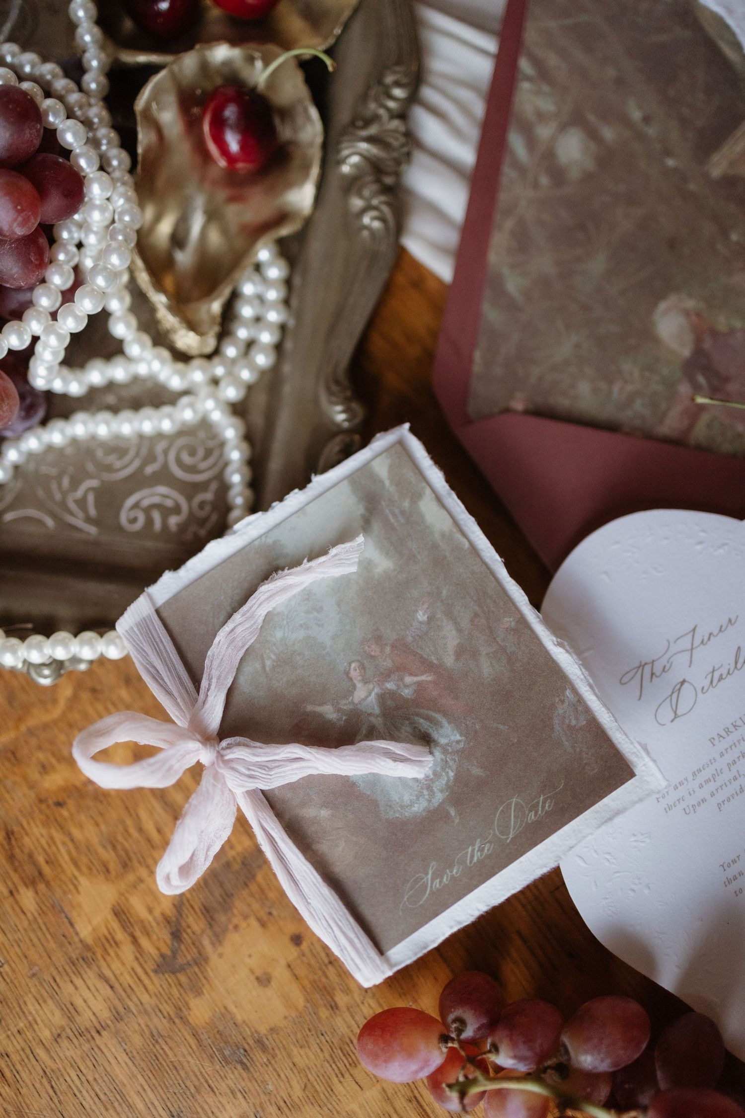 Elegant flatlay of invitations and bridal accessories