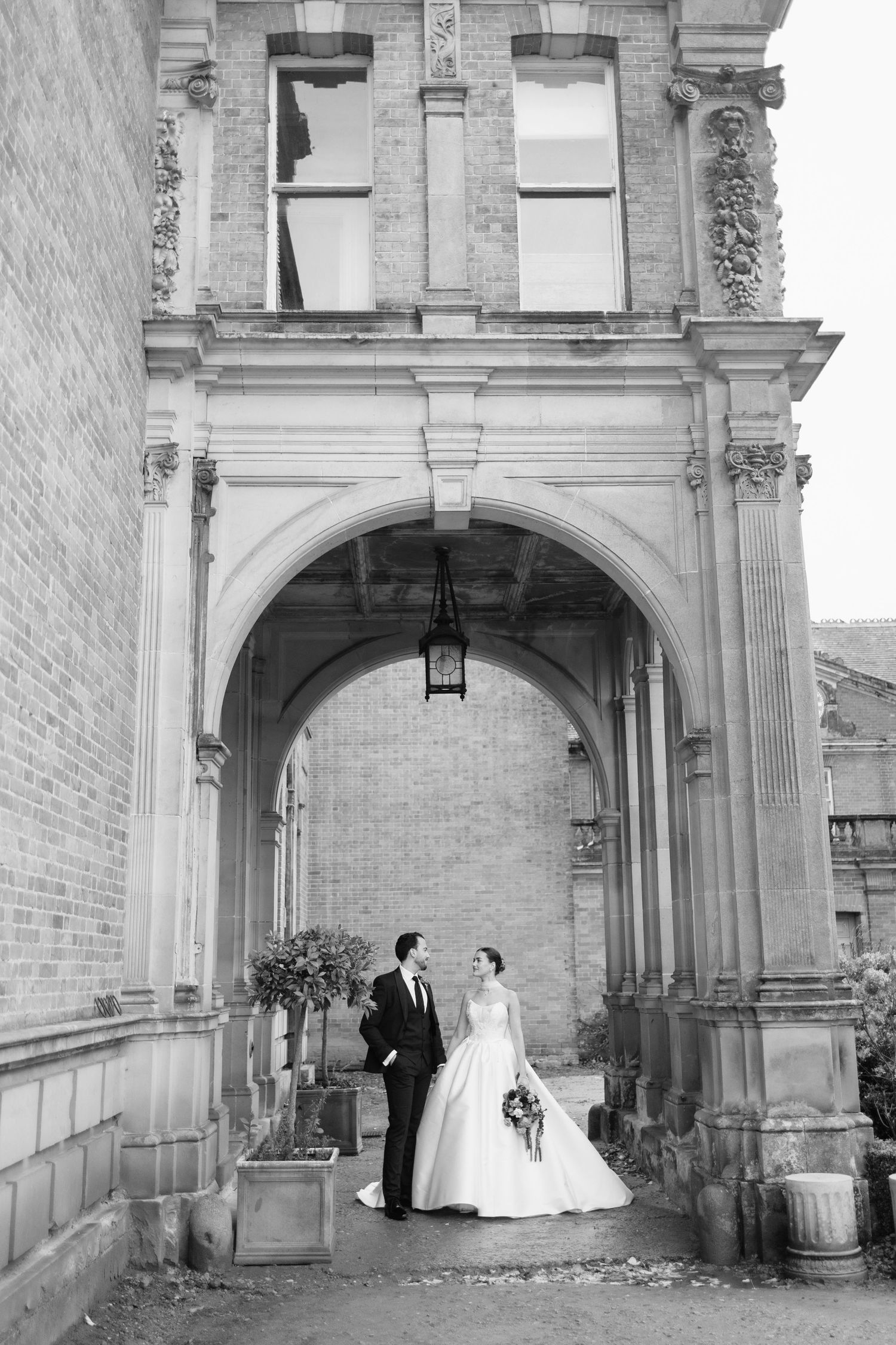 Bride walking through manicured lawns at Berwick House