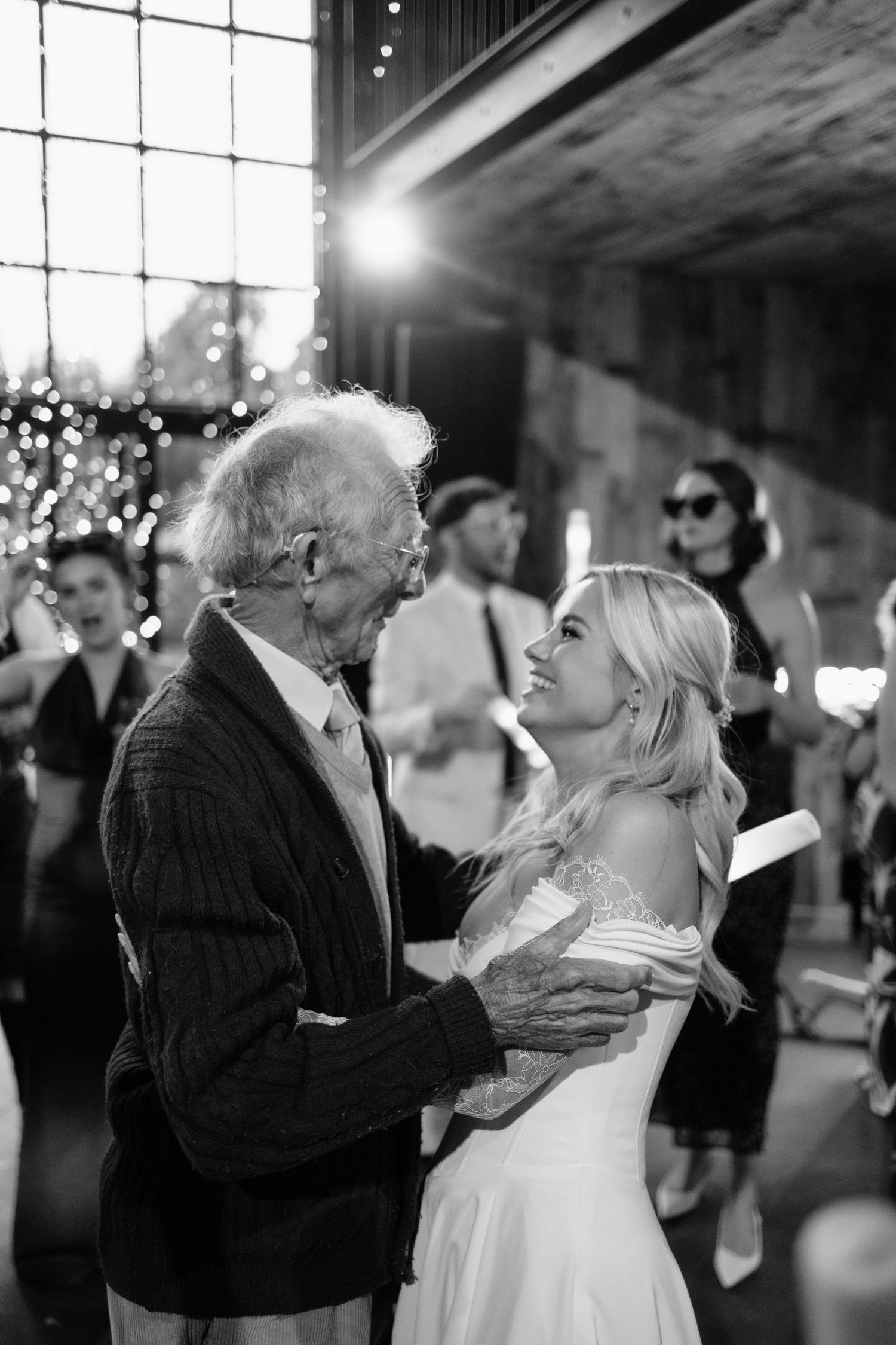 Guest candid of grandad and bride